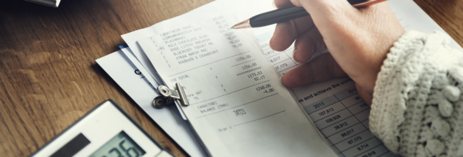 Person calculating receipts