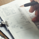 Person calculating receipts